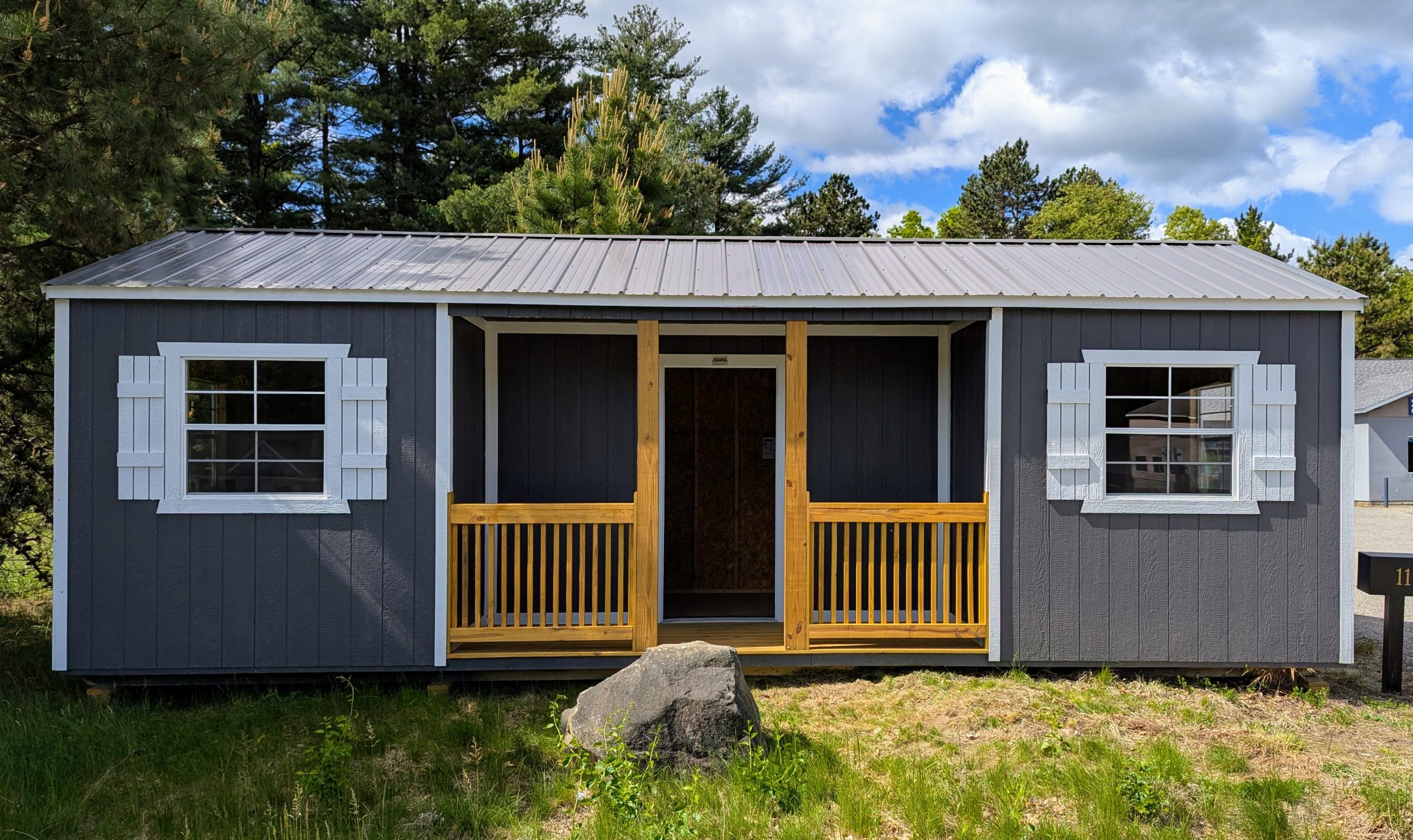 Utility Center Porch 12x28 storage shed on the lot at Bedford Home Consignment, Bedford NH