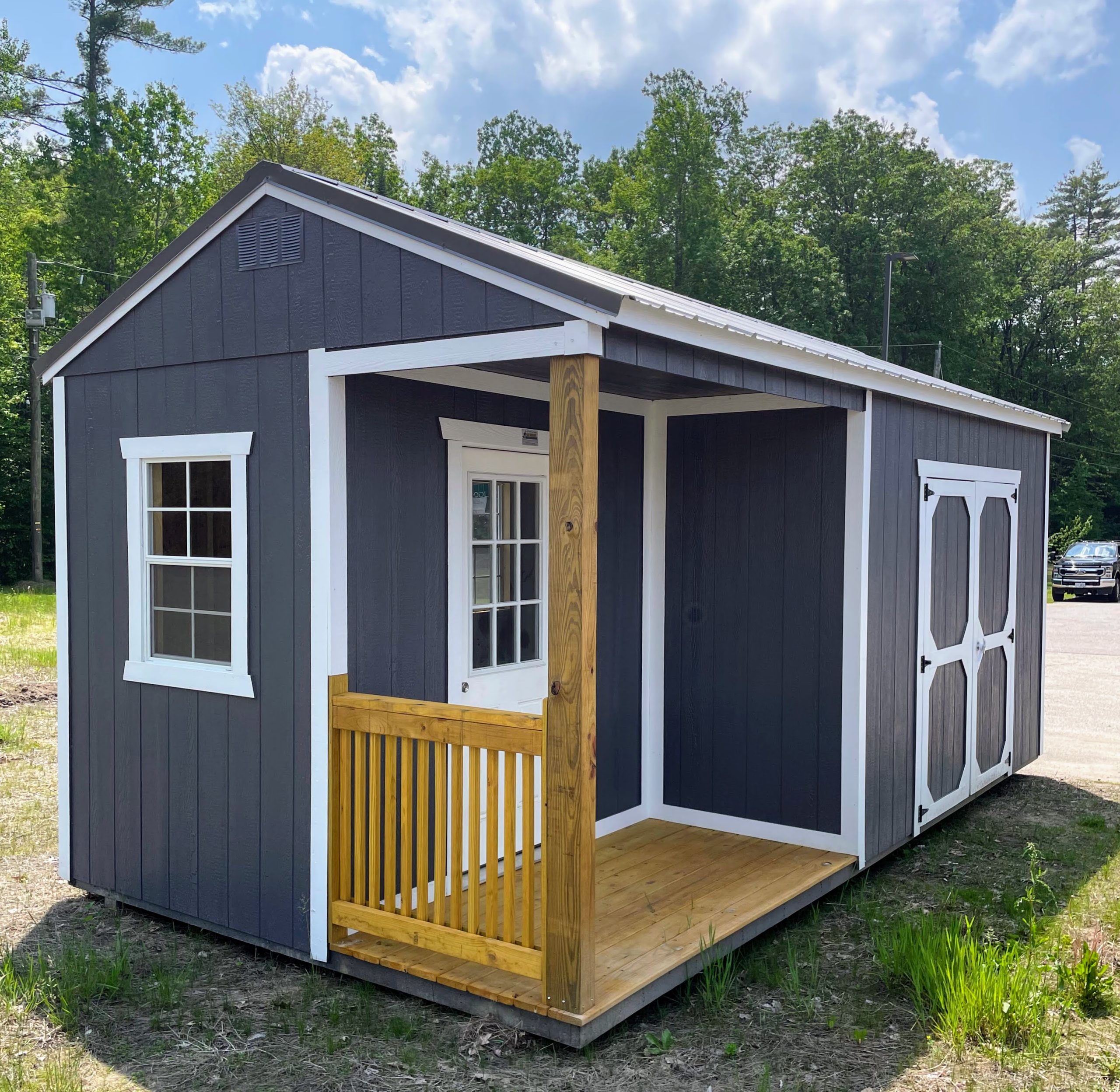 Utility 10x20 storage shed with porch on the New Hampton, NH lot at 337 NH-104